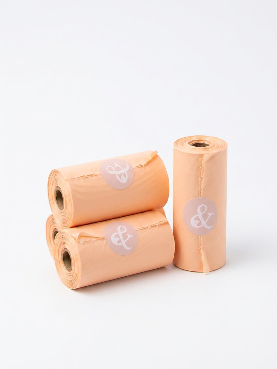 PET & ME compostable poop bag rolls in peach