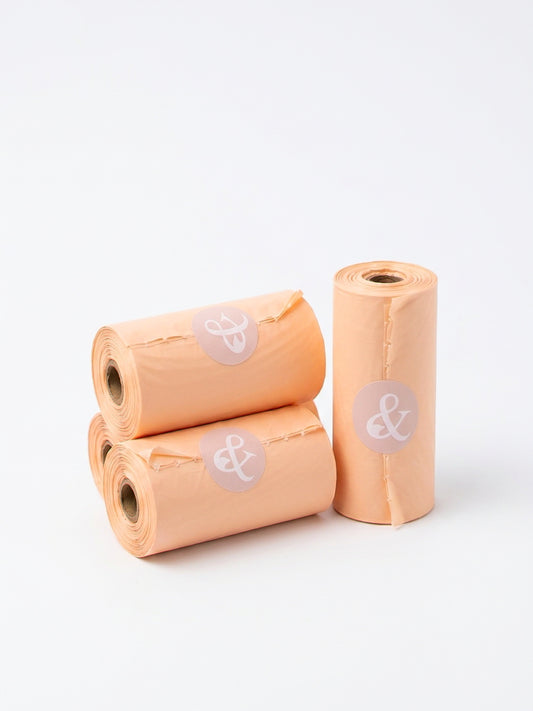 PET & ME compostable poop bag rolls in peach